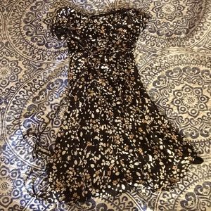A beautiful dress with brown and white flowers